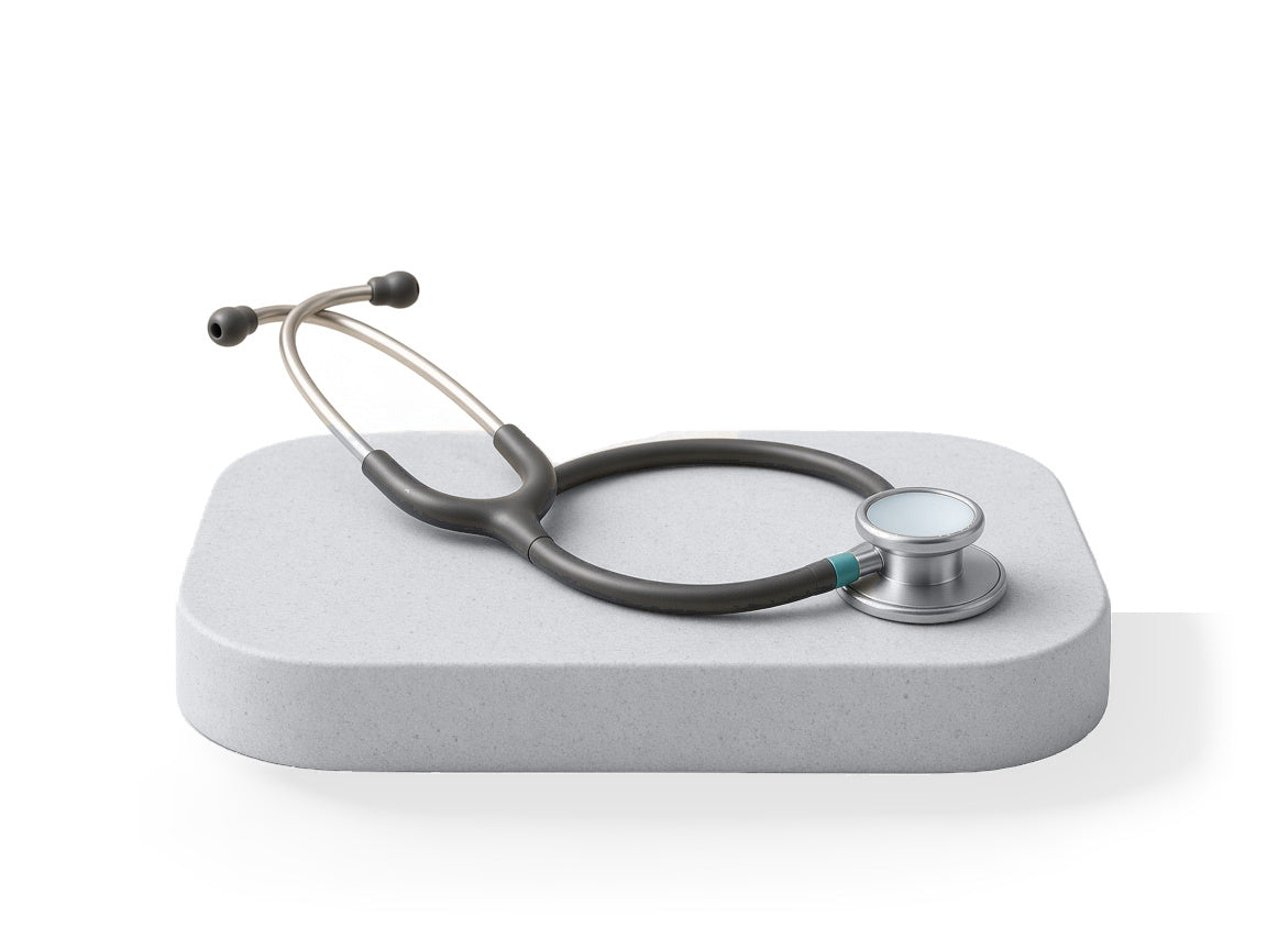 Graphite and silver stethoscope on a stone plinth